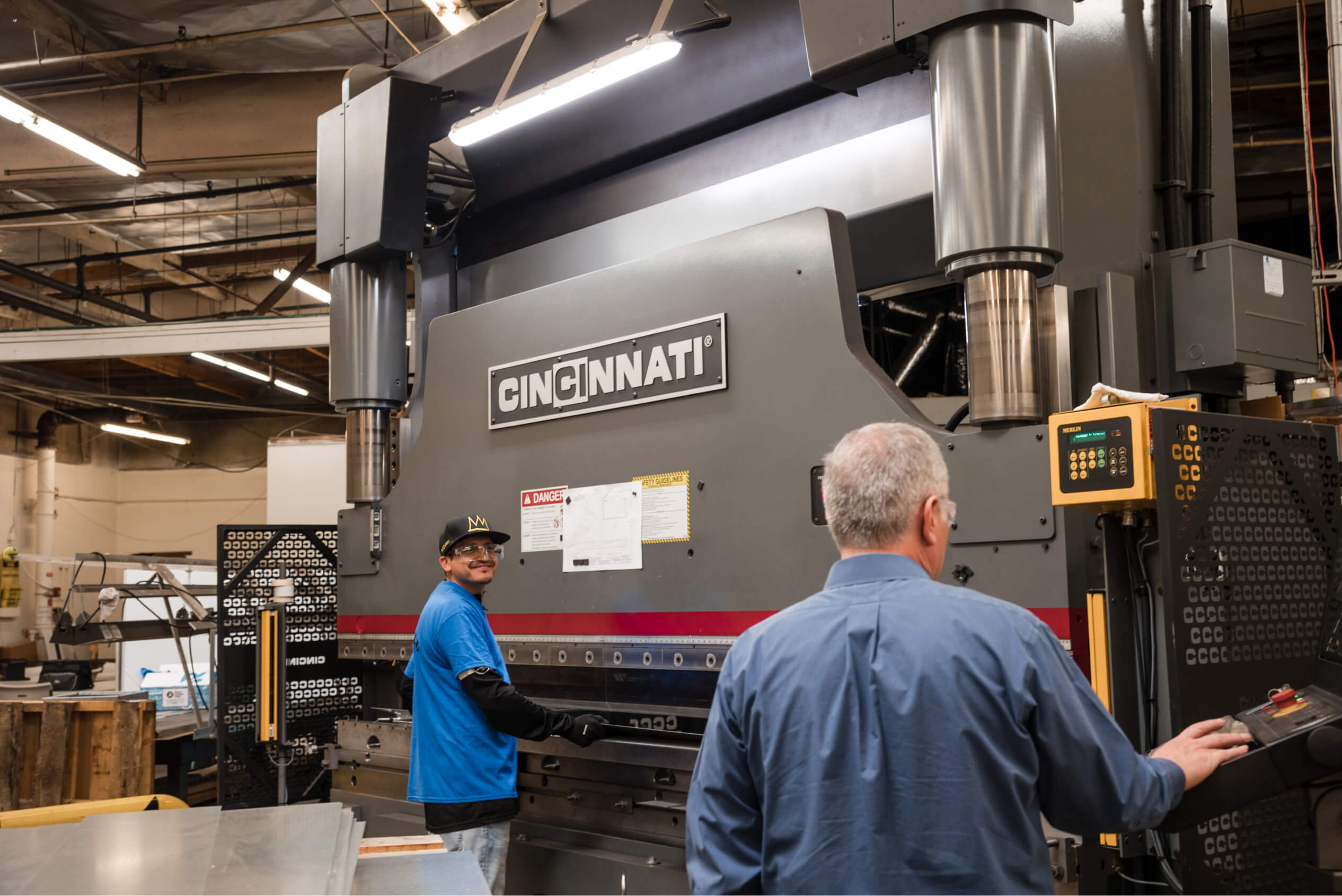 Adams Campbell employees work the Cincinnati machine at the production facilityi