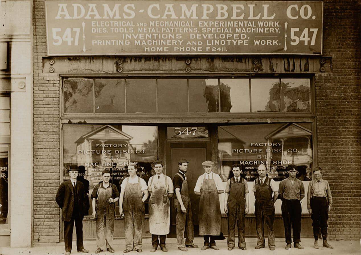 a photo of employees in front of the adams campbell co 547 metal manufacturing facility circa 1909